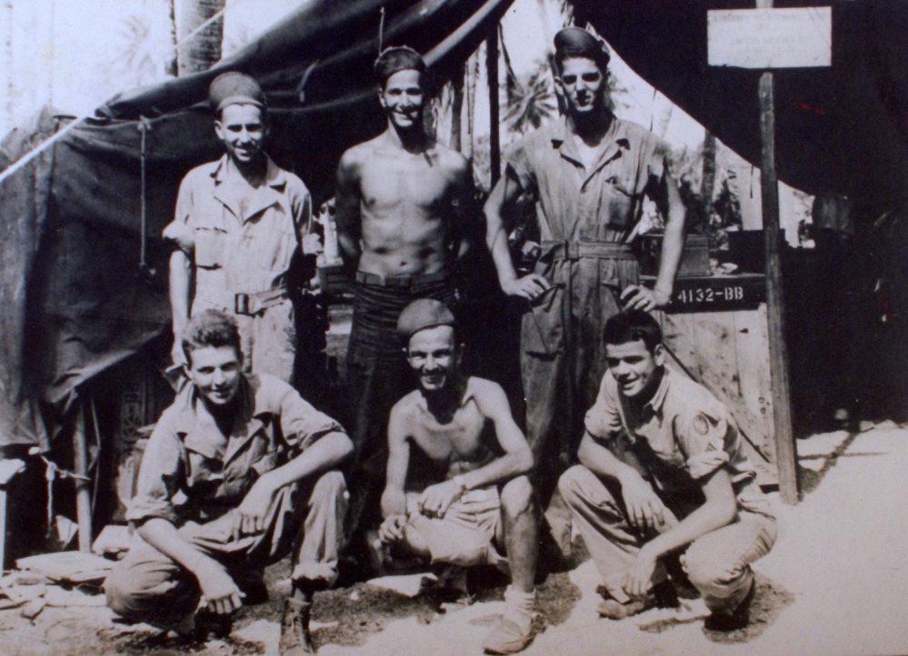 Taken in the Ellice Islands on Nanumea Nov. 1943 (Front Row - L to R) Sgt. Herman Keiser, Columbus, Ohio, Cpl. Duintzen L.A. California (lost large amount of weight - got out of service), Sgt. James B. Butt, Martinsburg, W. Virginia. (Back row L to R) Our boss T/Sgt Payne, Arkansas, S/Sgt Vogun, best buddy, Chicago, Ill, Me (L.D. Jackson), S/Sgt (Age 21)